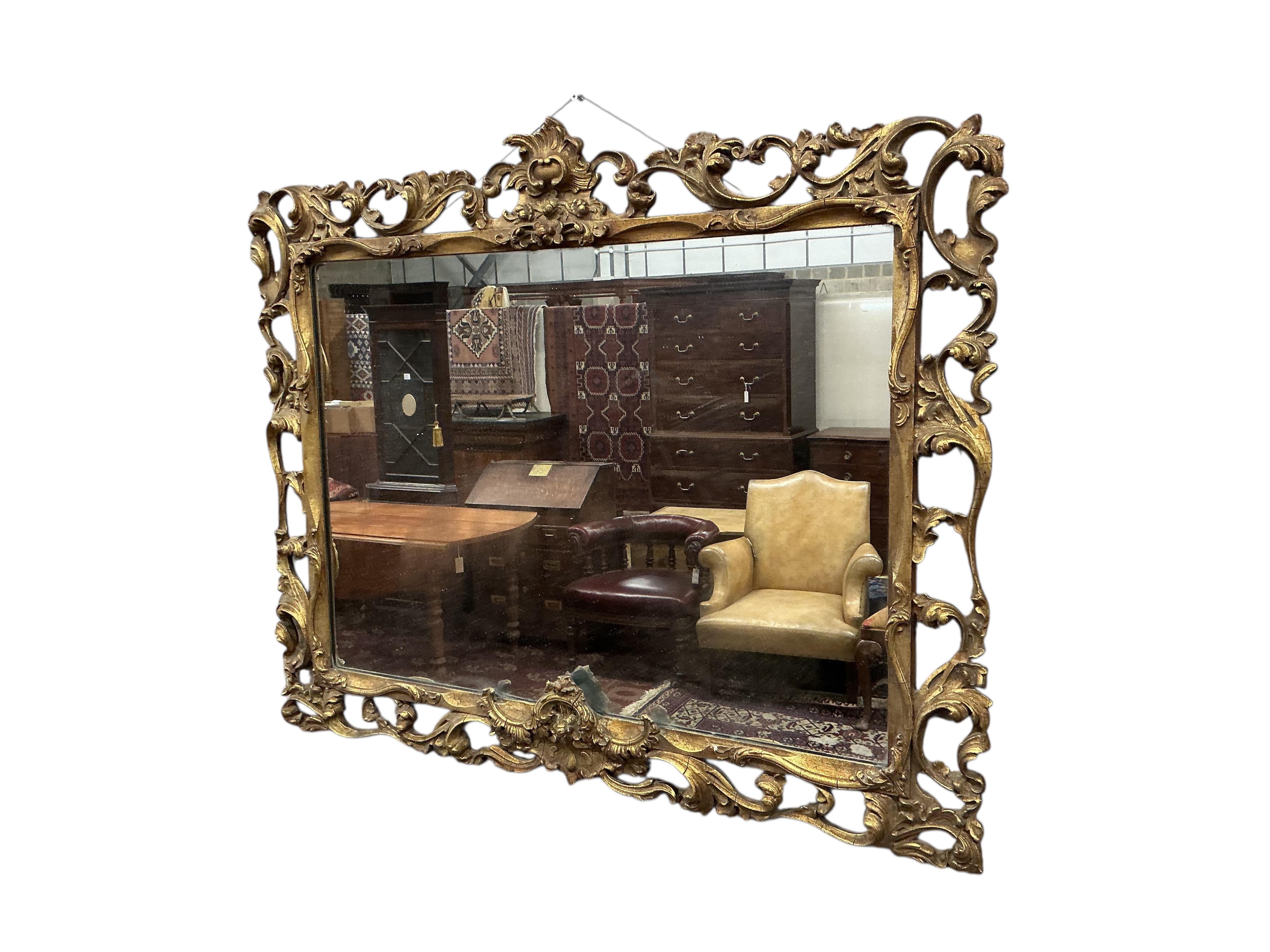 A giltwood mirror with openwork surround, width 88cm, height 70cm